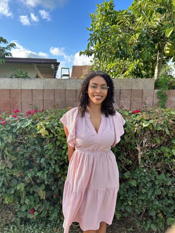 Me standing next to a bush.