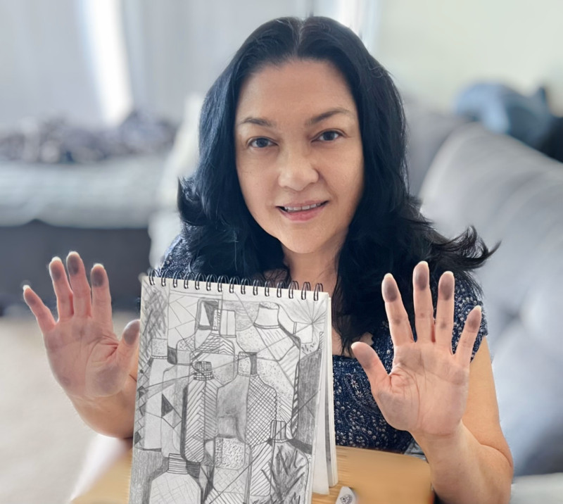 I'm holding up my Cubist drawing from Art 101.