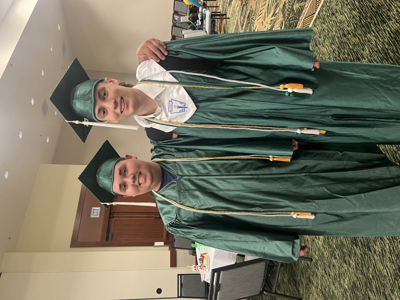 An image of me and my friend during our High School Graduation