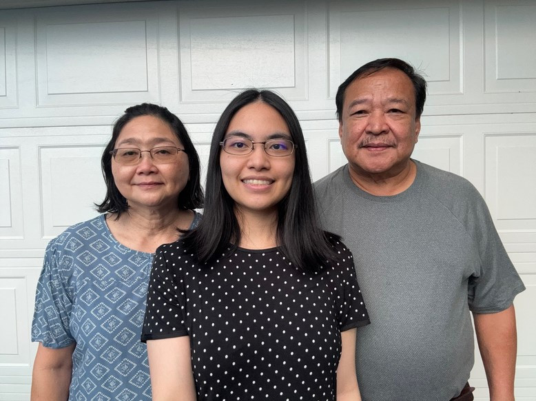 This is a photo of my mom on the left side, I'm in the center, and my dad on the right side.