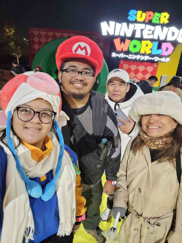 Group photo of Trinity, Roel, and Roel's mom and dad.